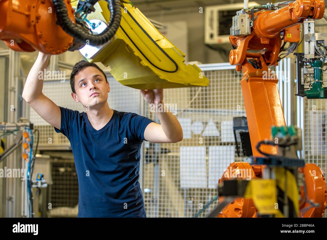 young developer testing new robot Stock Photo