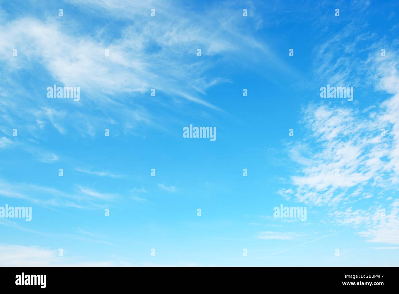 Blue sky and white fluffy clouds Stock Photo - Alamy