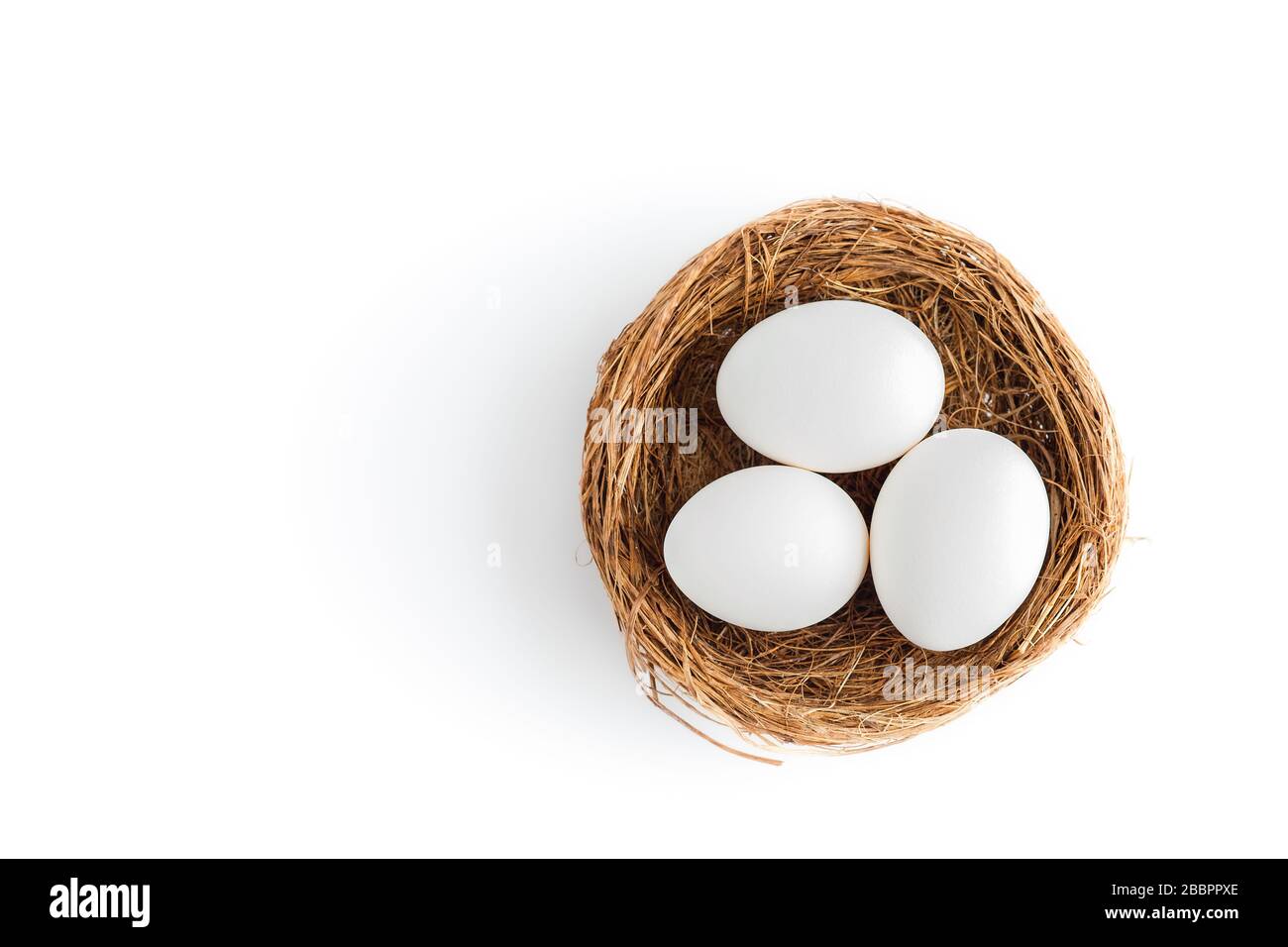 Tree chicken eggs lie in the nest on a white background, isolated Stock ...