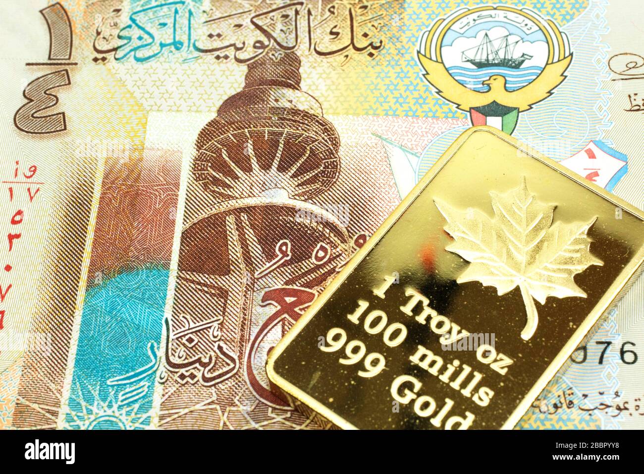 A macro image of a colorful quarter dinar bill from Kuwait with a gold bar.  Shot close up Stock Photo - Alamy