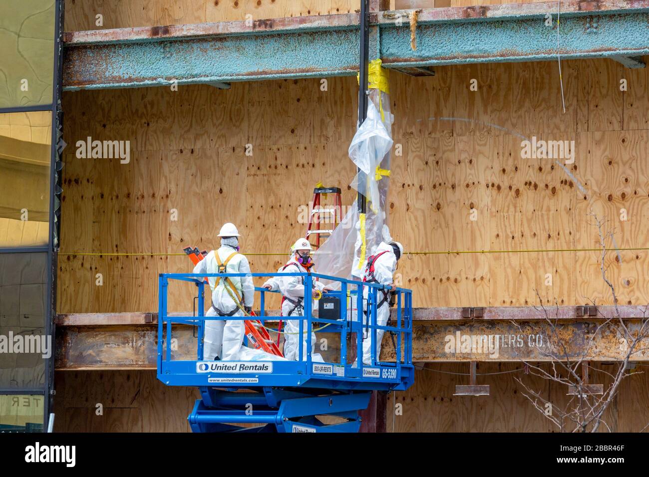Detroit, Michigan - Workers remove asbestos at a long-vacant downtown building which is being remodeled for a Capital One Cafe. Stock Photo