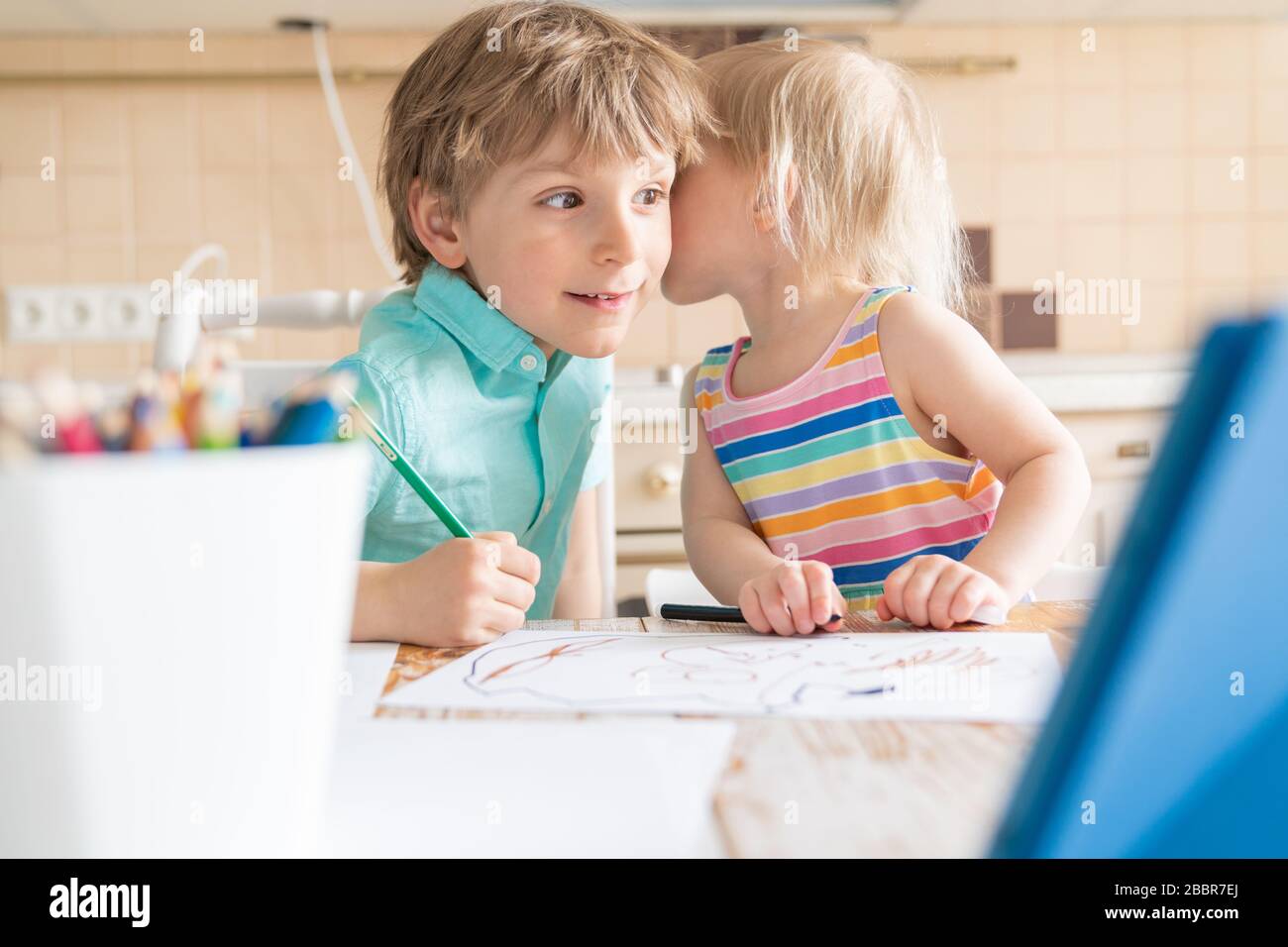 Covid lockdown - boy and girl learn to draw online during self-isolation Stock Photo