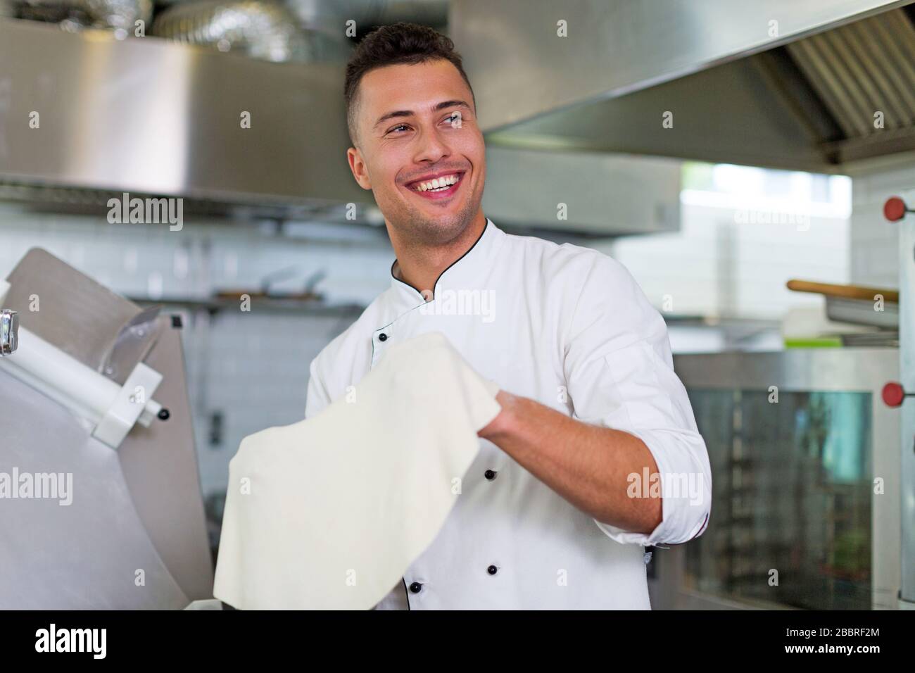 Professional chef in industrial kitchen Stock Photo