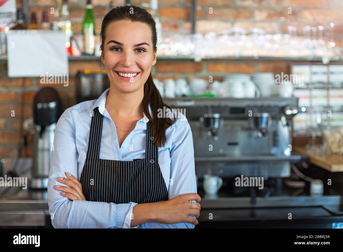 Woman working at cafe Stock Photo