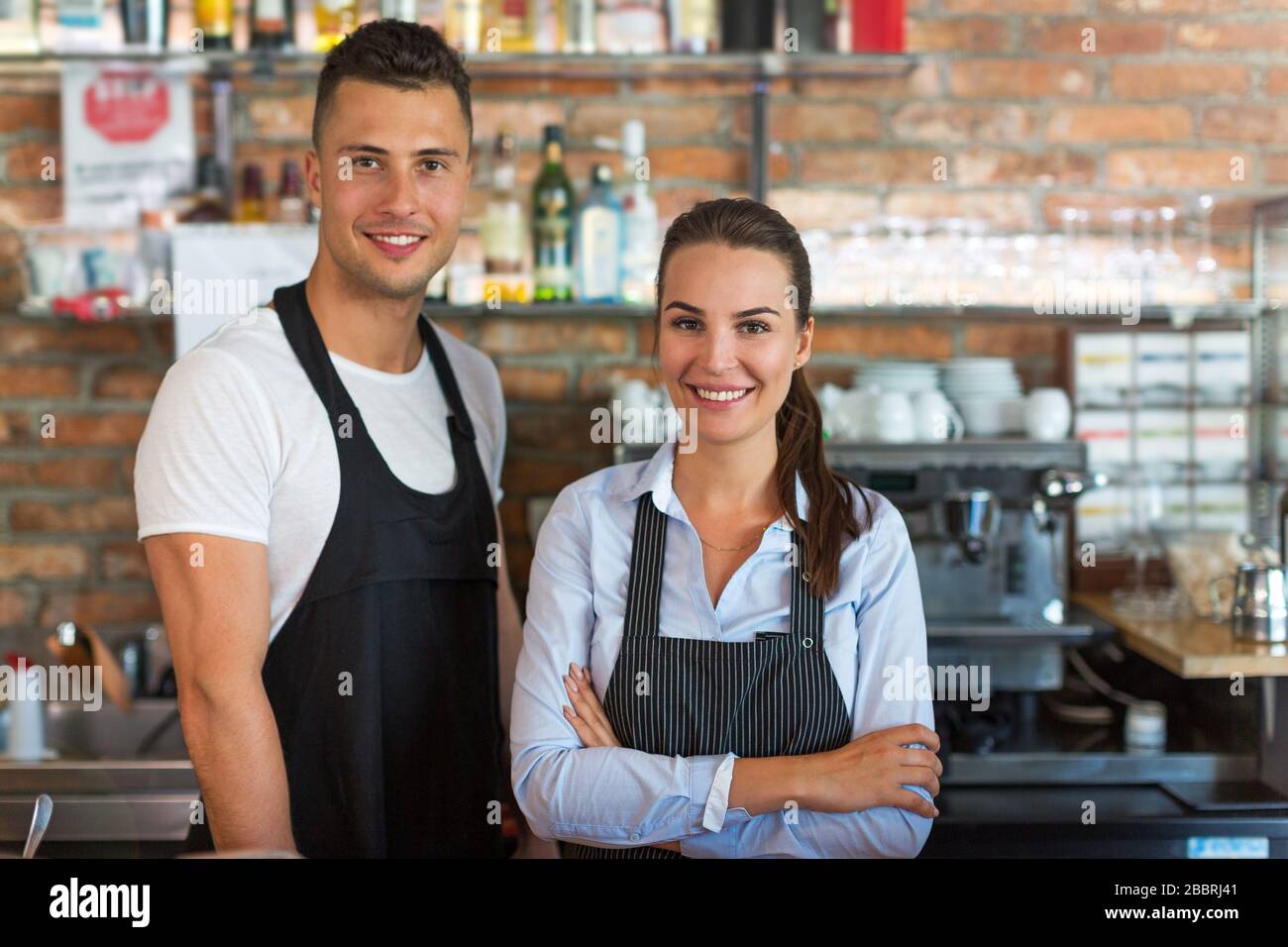 Woman and man working at cafe Stock Photo