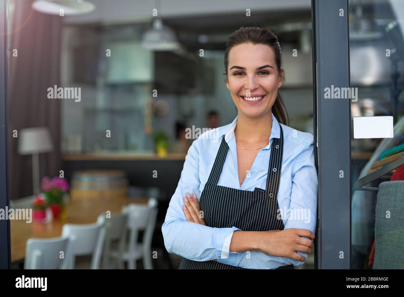 Woman working at cafe Stock Photo