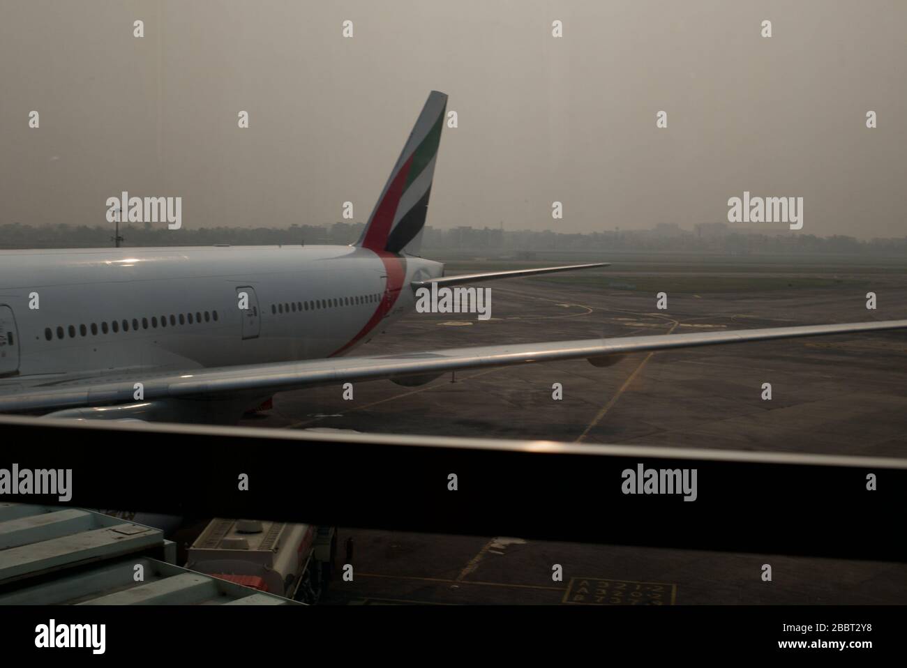 Emirate airline aircraft on tarmac refuelling Stock Photo