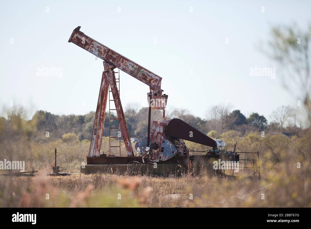 Old rusted oil rig in a field of Texas state, in Galveston, United ...