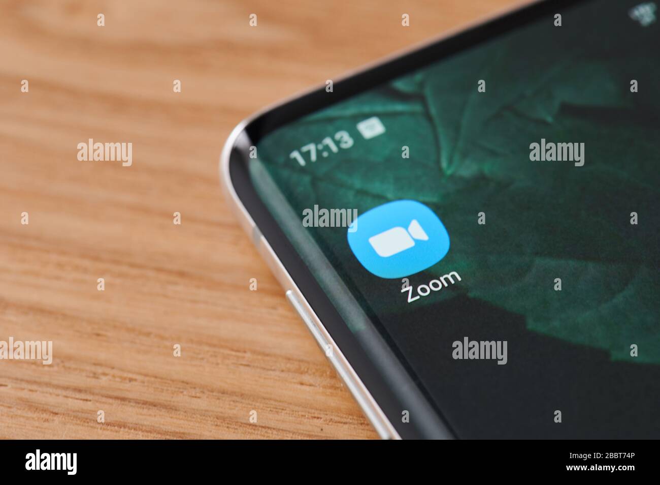 New-York , USA - April 1, 2020: Zoom mobile app icon on smartphone screen close up view Stock Photo
