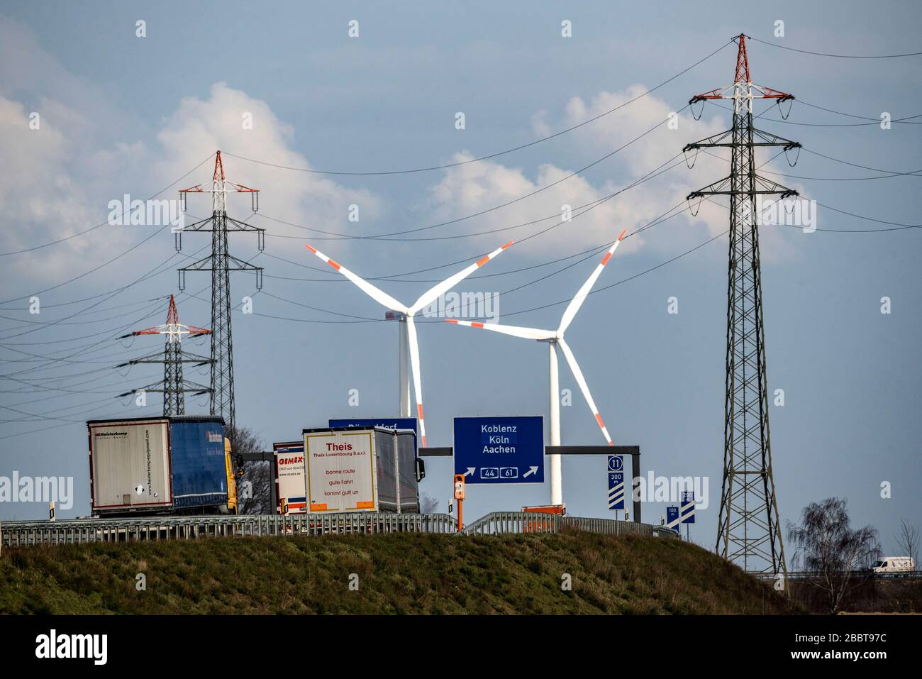 A 46 motorway, Holz motorway junction, access to A44 and A61, wind turbines, high-voltage pylons, near JŸchen, Germany Stock Photo