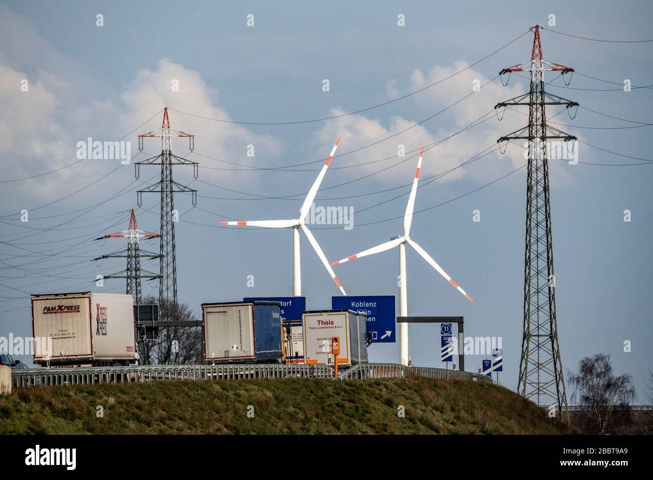 A 46 motorway, Holz motorway junction, access to A44 and A61, wind turbines, high-voltage pylons, near JŸchen, Germany Stock Photo