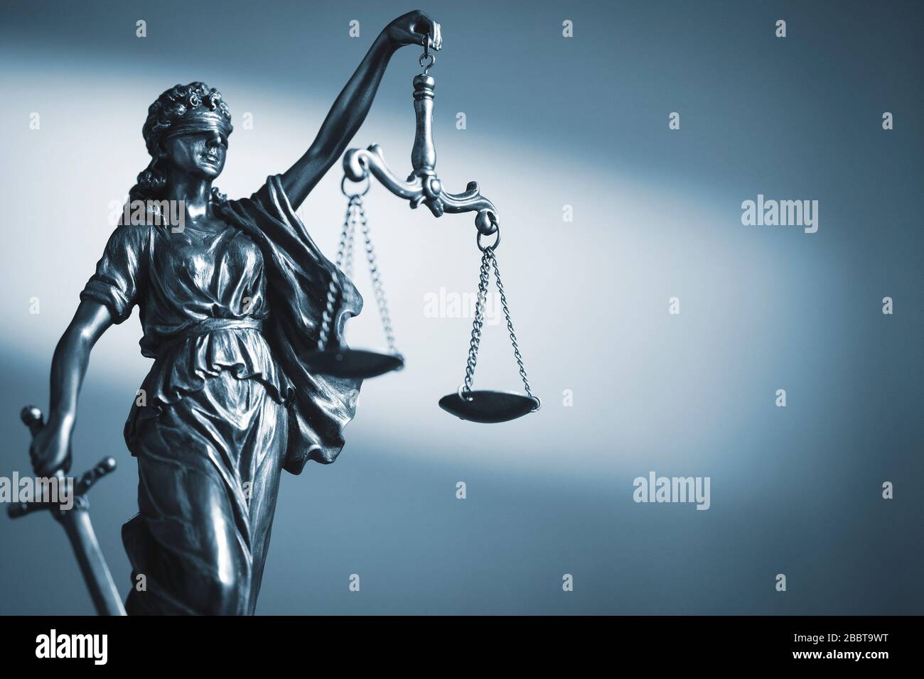 Figure of Justice holding scales and a sword Stock Photo