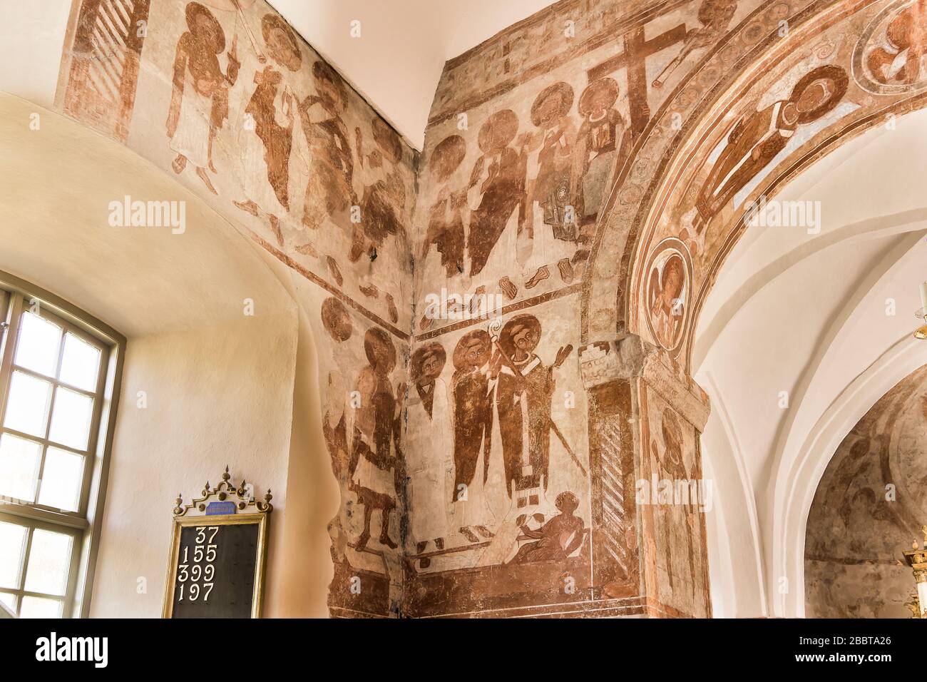 Romanesque frescos from 1125 on the walls of Finja church in Sweden, May 9, 2018 Stock Photo