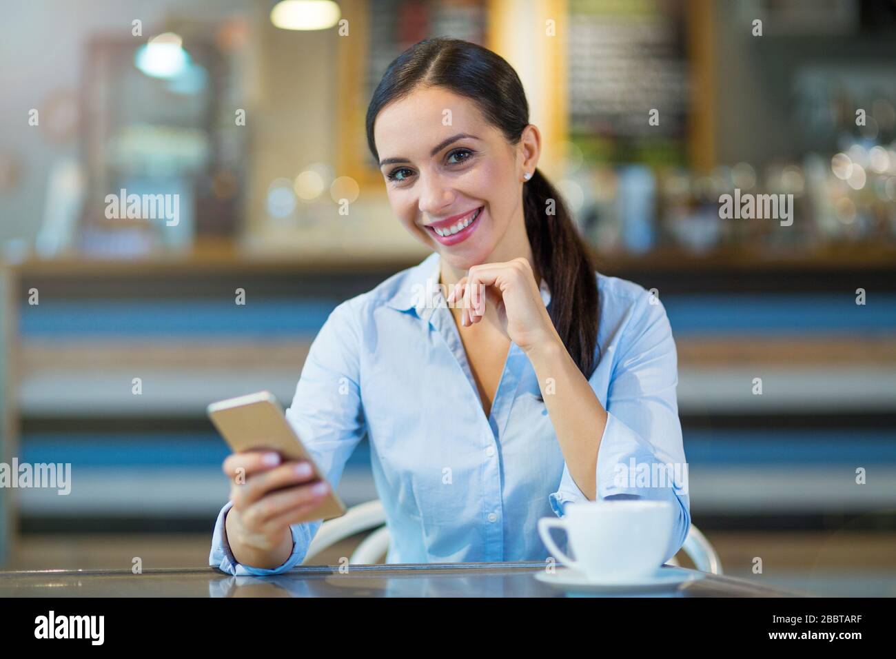 Young businesswoman working at cafe Stock Photo