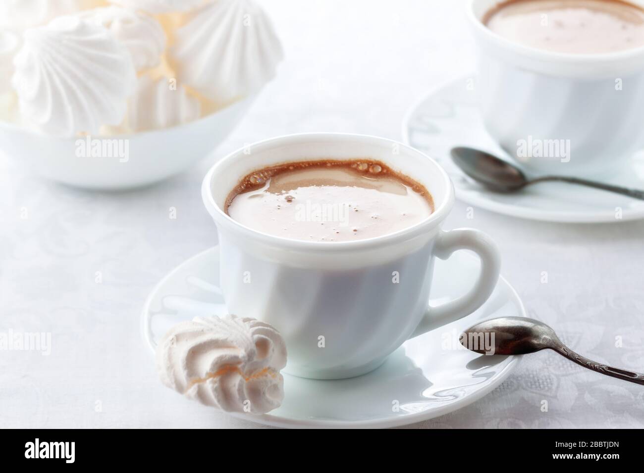 A cup of fresh coffee with cream and a gentle, airy Bizet Stock Photo