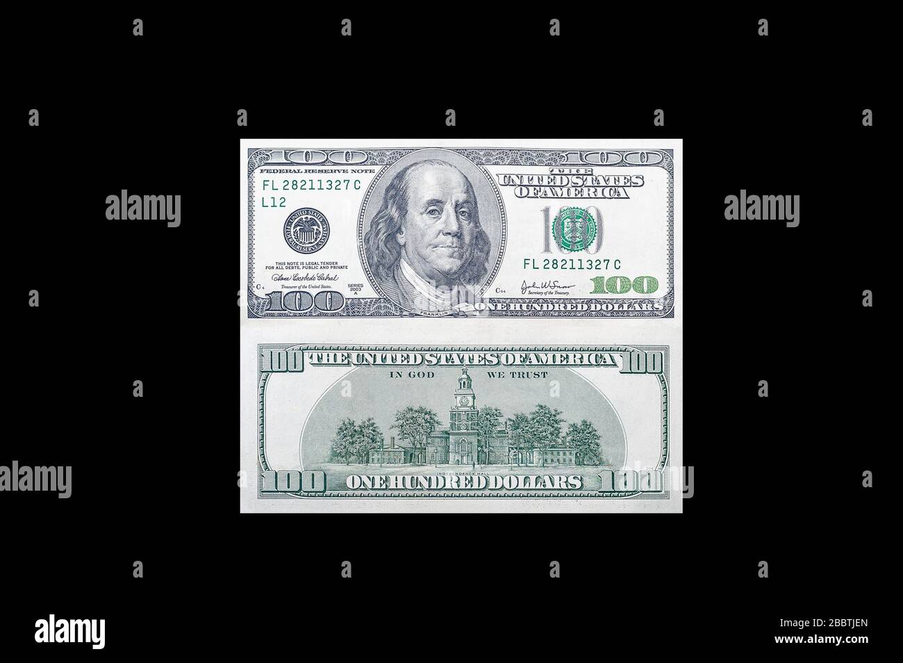 Front and back side of a 100 USA dollar bill with a portrait of American President Benjamin Franklin on an isolated black background Stock Photo