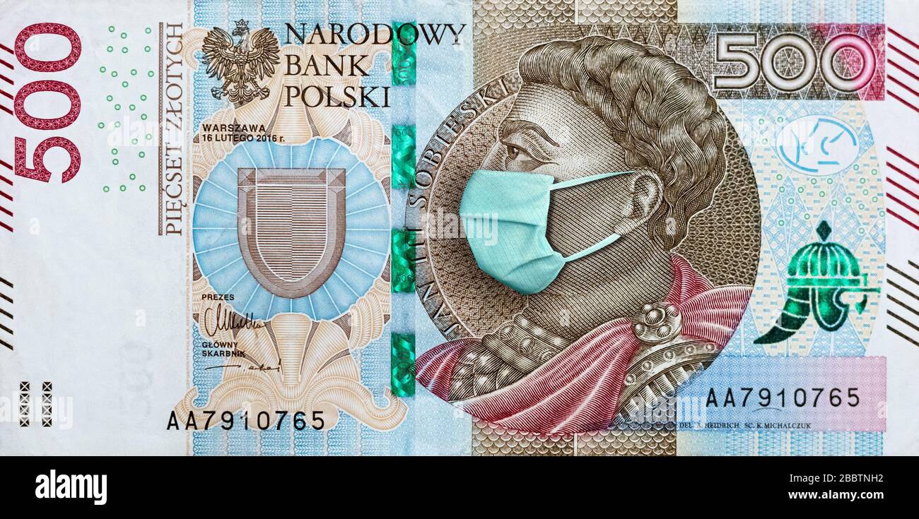 Coronavirus in Poland. Quarantine and global recession. 500 Polish zloty banknote with face mask against infection. Global economy hit by covid19. Stock Photo
