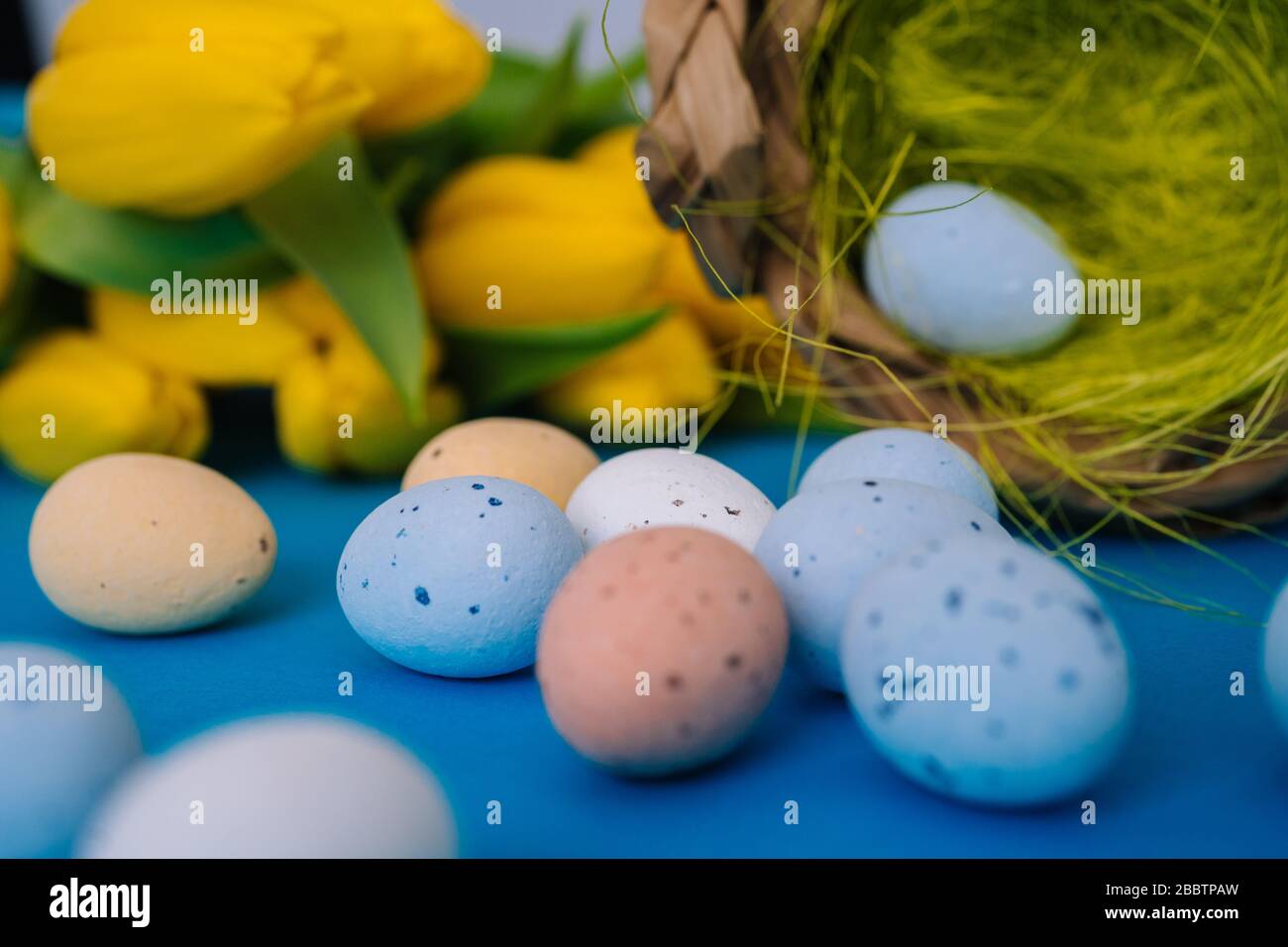 Happy Easter. Easter holiday decorations on trendy colored classic blue ...