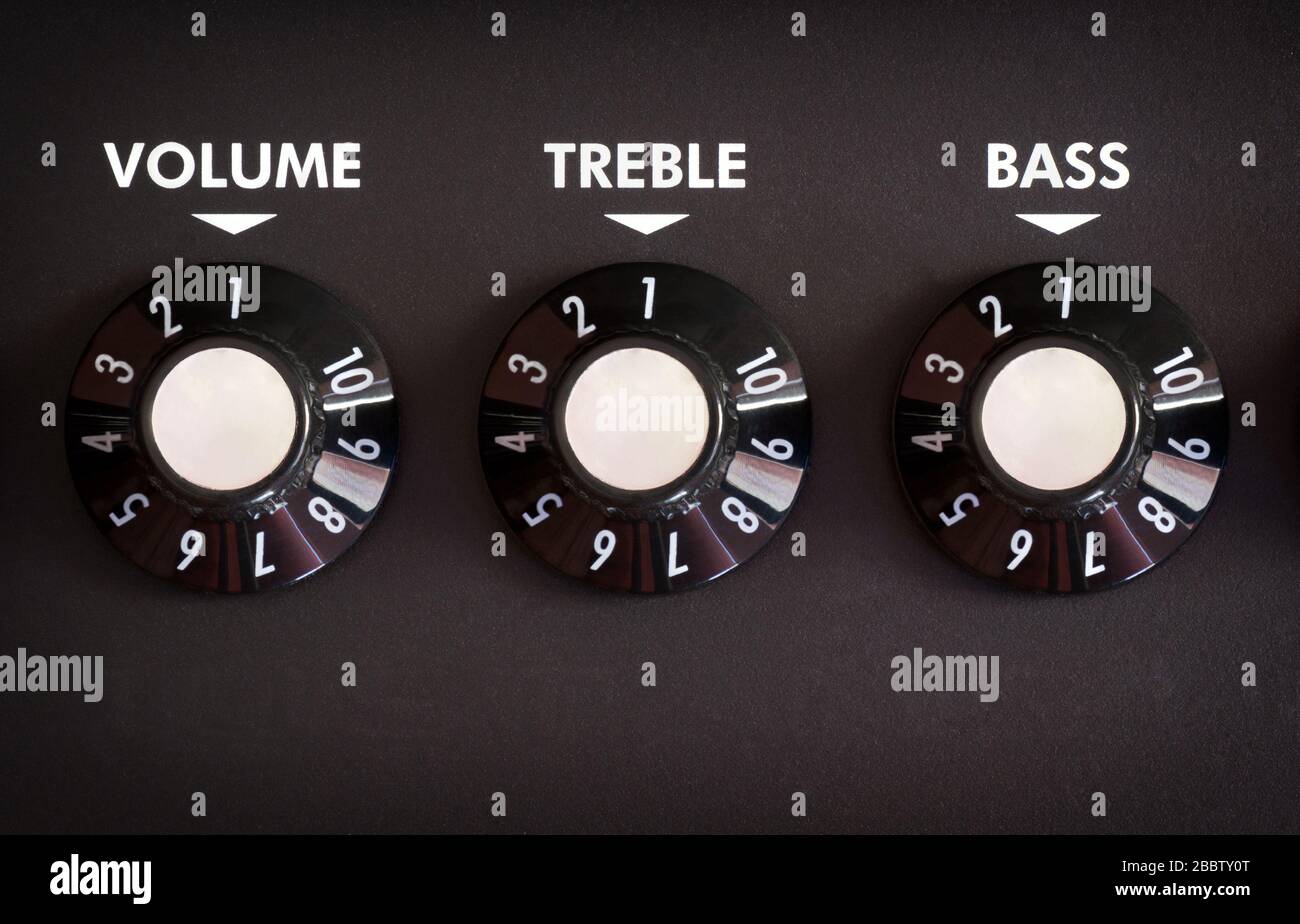 Guitar amplifier control panel with volume, bass and treble controls
