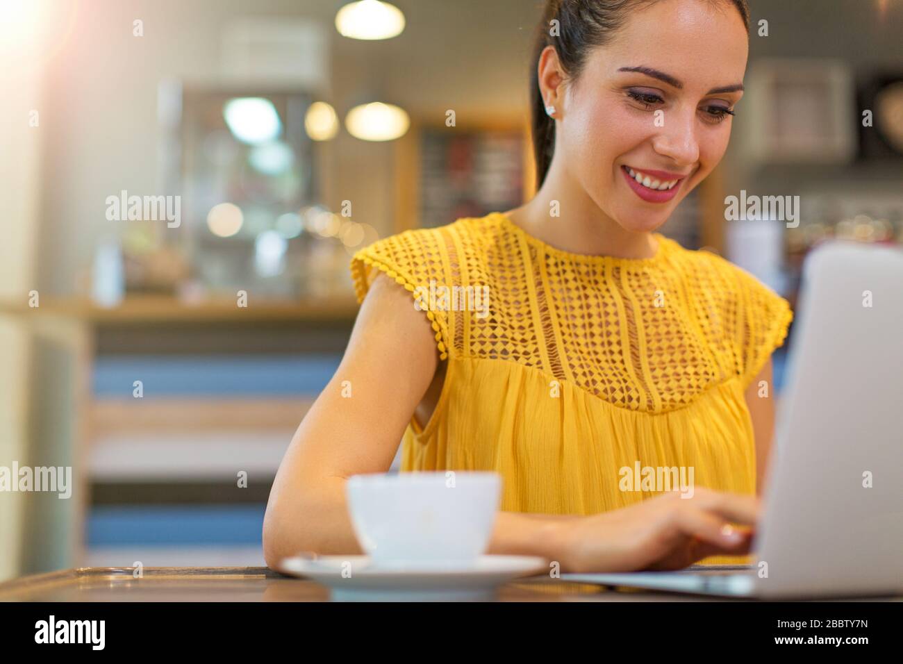 Young businesswoman working at cafe Stock Photo