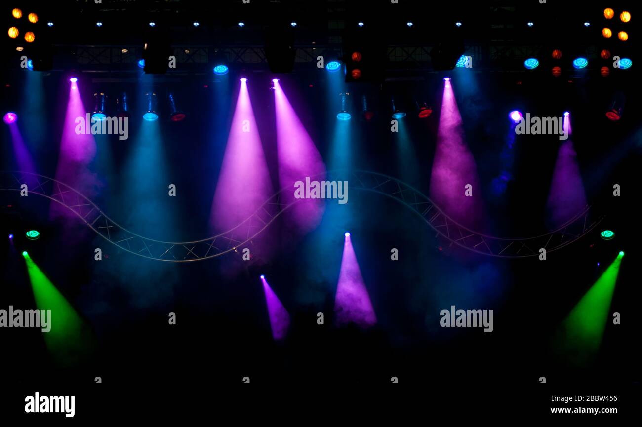Stage lights and Laser rays with smoky effect background Stock Photo Alamy
