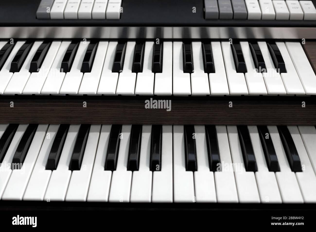 Top view of a church organ keyboard. The organ is a musical instrument used in churches or