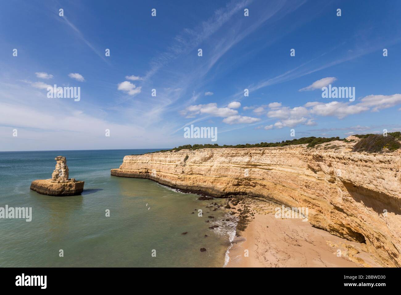 Coast west of Alporchinhas with sea stack, Algarve, Portugal Stock Photo