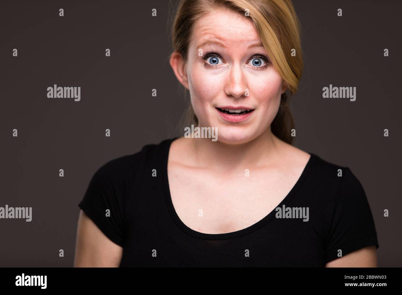 Uncertain woman surprised young hi-res stock photography and images - Alamy