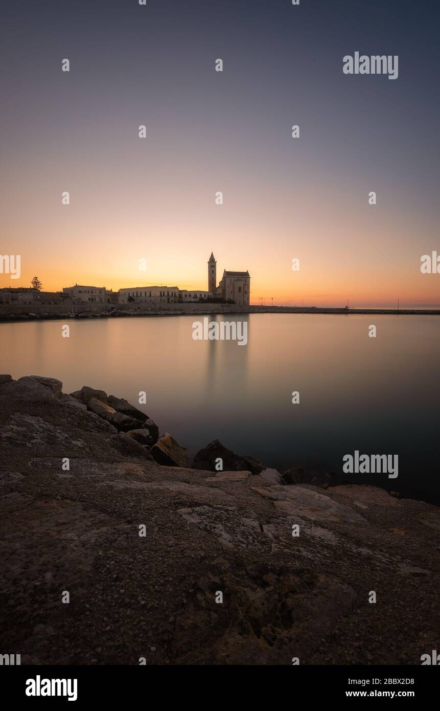 Sunset over the port of Trani, Italy. Stock Photo