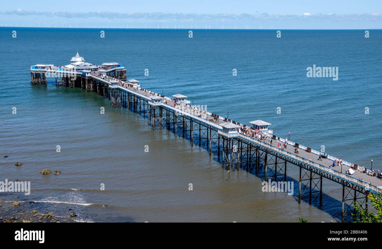 Holidaymakers on Llandudno pier, seaside resort of Llandudno, North Wales, UK. At 2,295 feet, the pier is the longest in Wales. Stock Photo