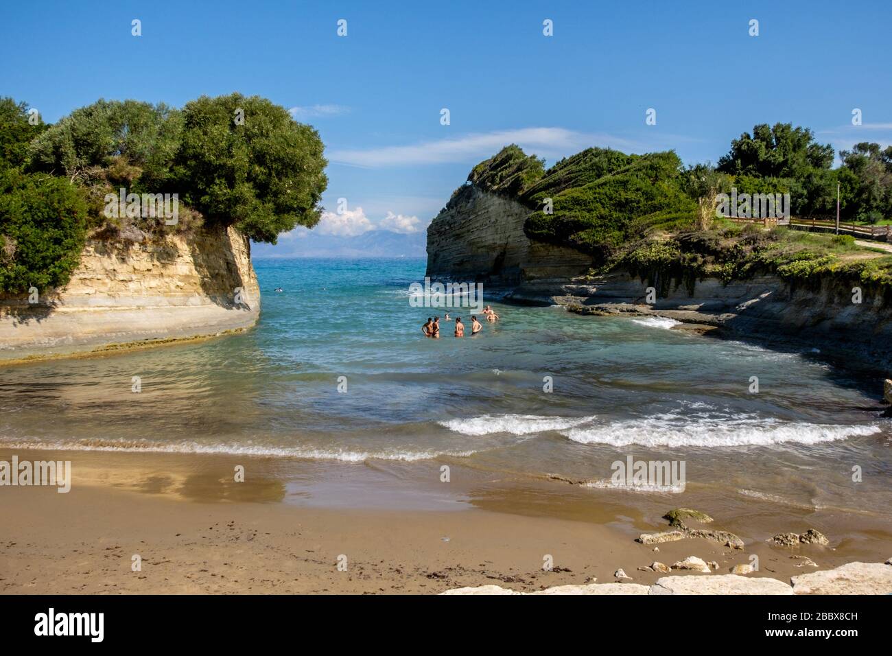 Holidaymakers enjoying the sea at Canal d'Amour in Sidari. One of the most spectacular nature scenes of Corfu Greece. Stock Photo