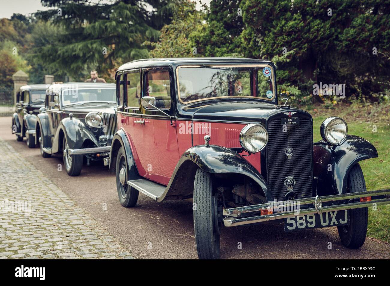 A line of vintage motor cars headed by a 1932 Hillman Minx 589 UXJ, Papplewick Pumping Station 1940's event, England Stock Photo