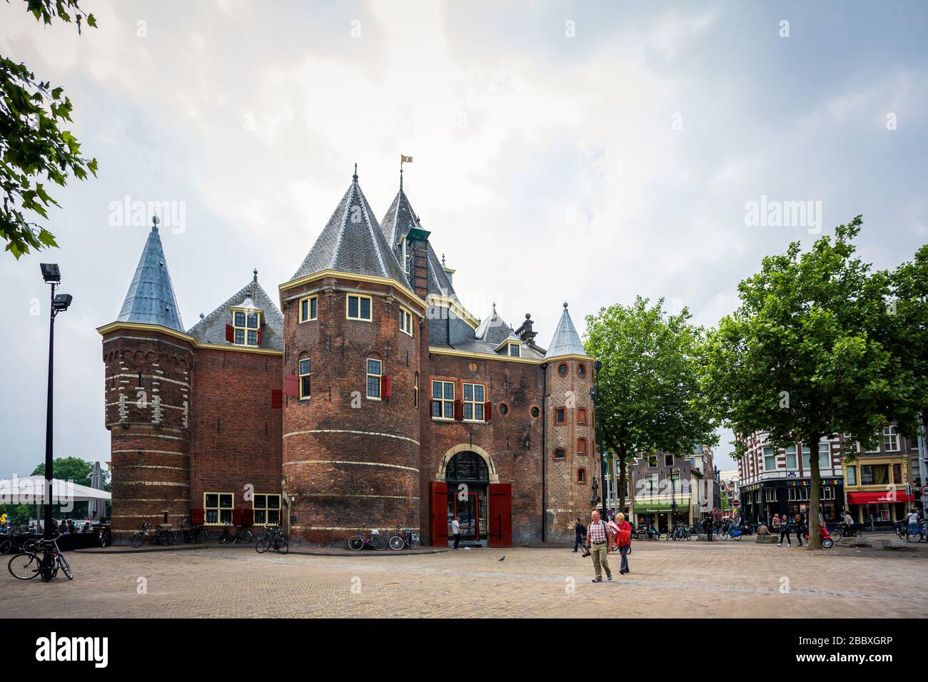 De Waag a famous Amsterdam restaurant and café in a cloudy day. Stock Photo