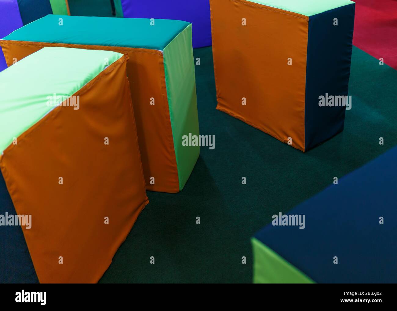 Large soft cubes for playing children in the playroom. Stock Photo