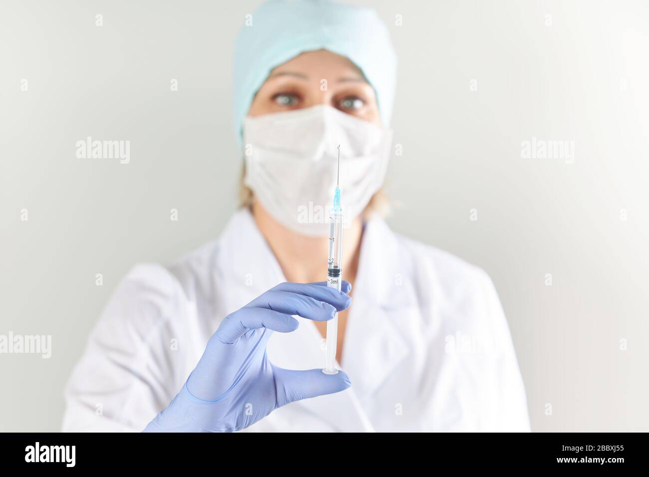 Female doctor prepared to give an injection to a sick patient Stock ...