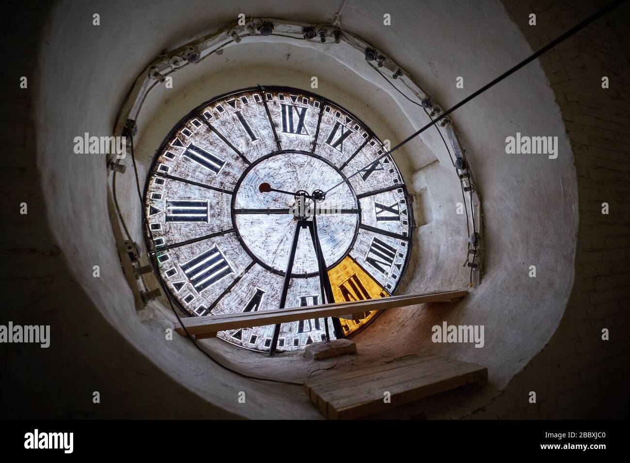 View of the large clockface of an antique clock on the tower Stock