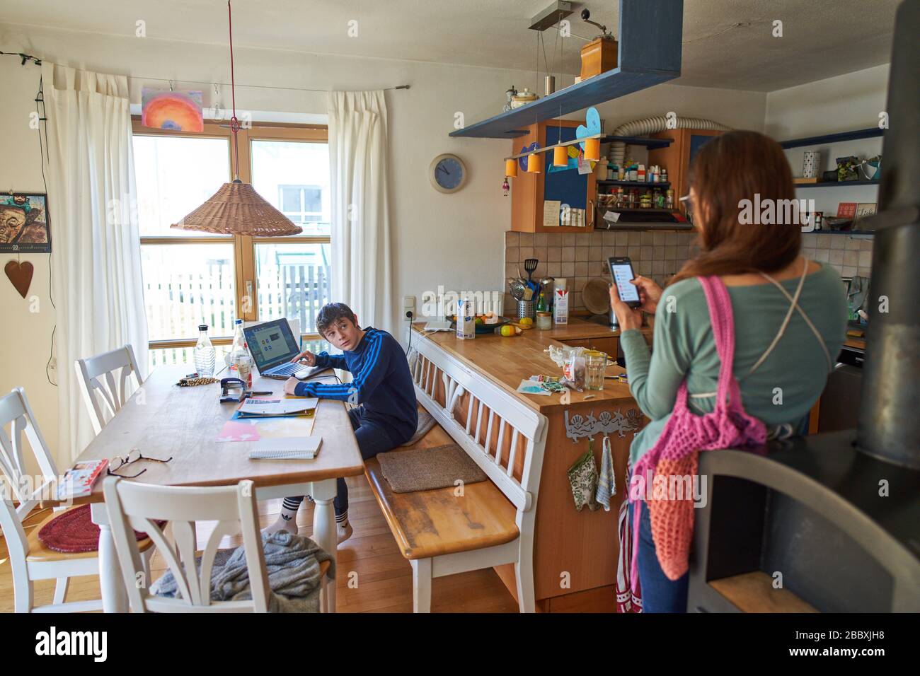 Kaufbeuren, Germany, April 01, 2020. Students with mother are frustrated and fighting while learning at home with computer and iphone due to the Corona virus disease (COVID-19) on April 01, 2020 in Kaufbeuren, Germany  Model released © Peter Schatz / Alamy Live News Stock Photo