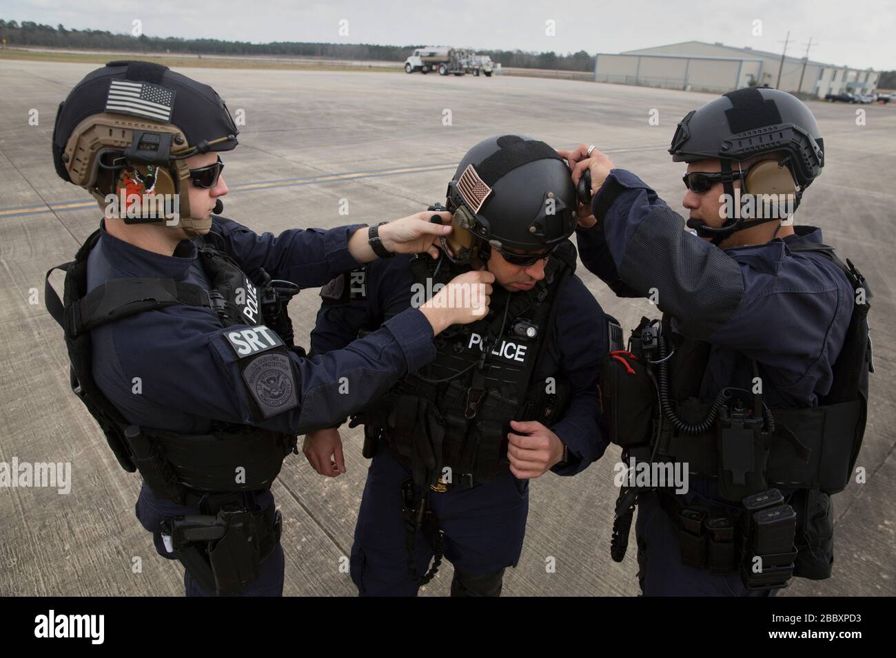 Members of the U.S. Customs and Border Protection, Office of Field Operations Special Response Team, suit-up prior to an air-intercept training exercise as they provide airspace security for Super Bowl LI, in Conroe, Texas, Feb. 1, 2017. Units with Air and Marine Operations and Office of Field Operations teamed up with the Civil Air Patrol  to practice an air-to-air intercept using two AMO UH-60 Black Hawk helicopters and two C-550 Citation jets to track down a simulated incursion into restricted airspace. Stock Photo
