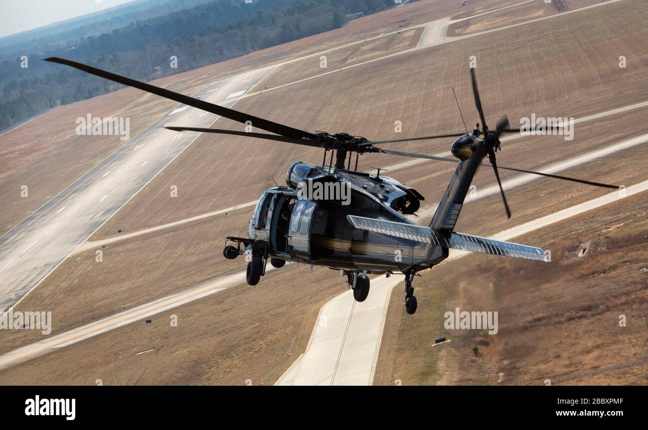 A UH-60 Black Hawk helicopter of U.S. Customs and Border Protection, Air and Marine Operations, returns from a flight to Conroe, Texas, Feb. 1, 2017. Units with  Air and Marine Operations and Office of Field Operations teamed up with the Civil Air Patrol  to practice an air-to-air intercept using two AMO UH-60 Black Hawk helicopters and two C-550 Citation jets to track down a simulated incursion into restricted airspace. Stock Photo