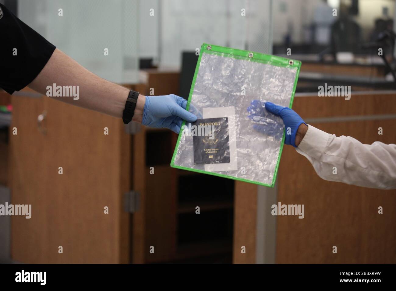 US Customs and Border Protection (CBP) officers screen and welcome arriving travelers at Hartsfield-Jackson Atlanta International Airport, March 13, 2020. Stock Photo