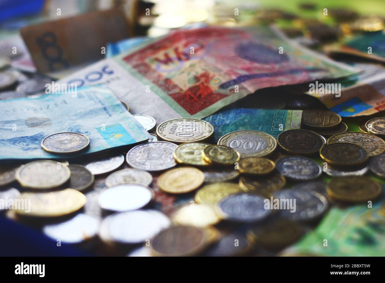 Close up view on kazakh and kyrgyz currencies banknotes and coins Stock Photo