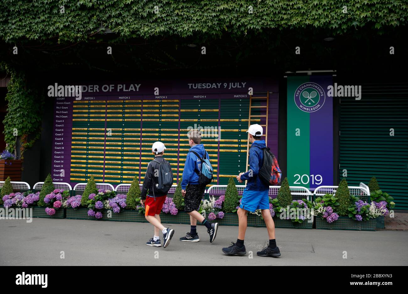 London, UK. 9th July, 2019. File photo taken on July 9, 2019 shows children passing by the order of play during Day 8 of the 2019 Wimbledon Tennis Championships in London, Britain. This year's Wimbledon has been cancelled due to the public health concerns related to the ongoing COVID-19 pandemic, the All England Club (AELTC) announced after an emergency meeting on Wednesday. Credit: Han Yan/Xinhua/Alamy Live News Stock Photo