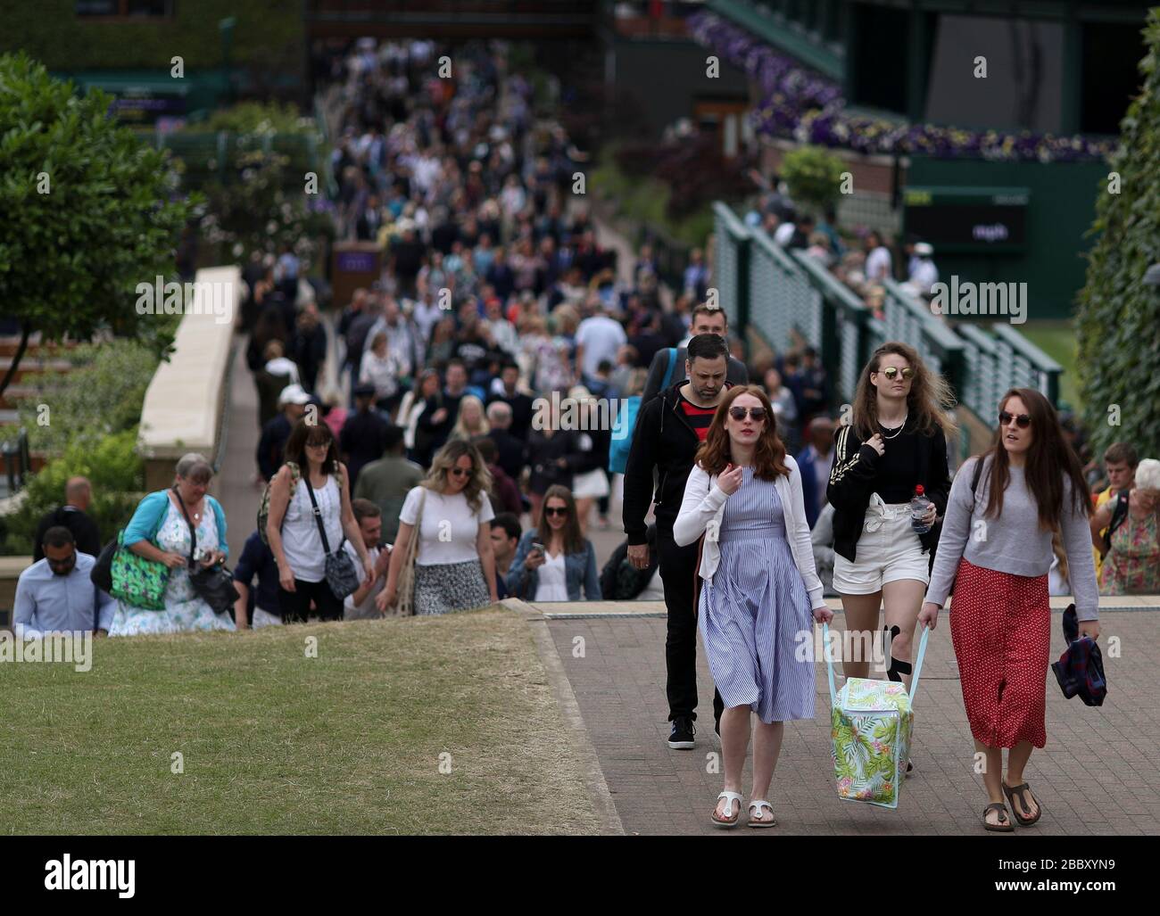 London, UK. 9th July, 2019. File photo taken on July 9, 2019 shows spectators arriving during Day 8 of the 2019 Wimbledon Tennis Championships in London, Britain. This year's Wimbledon has been cancelled due to the public health concerns related to the ongoing COVID-19 pandemic, the All England Club (AELTC) announced after an emergency meeting on Wednesday. Credit: Han Yan/Xinhua/Alamy Live News Stock Photo