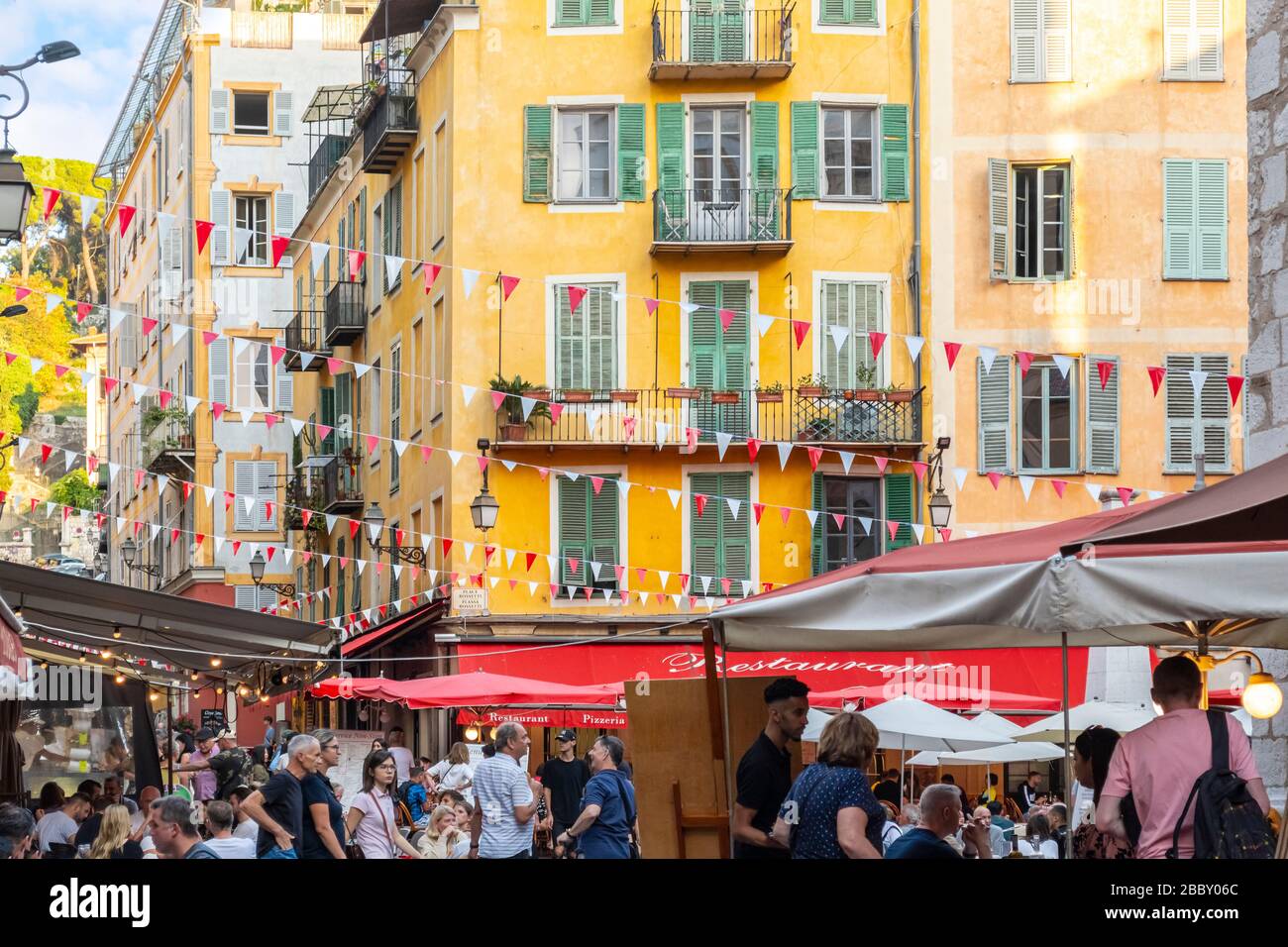 A busy, crowded Place Rossetti Square of shops and cafes in the Old Town Vieux Nice district of Nice, France, on the Riviera. Stock Photo
