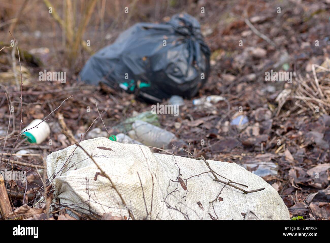 bags with garbage left in the forest Stock Photo