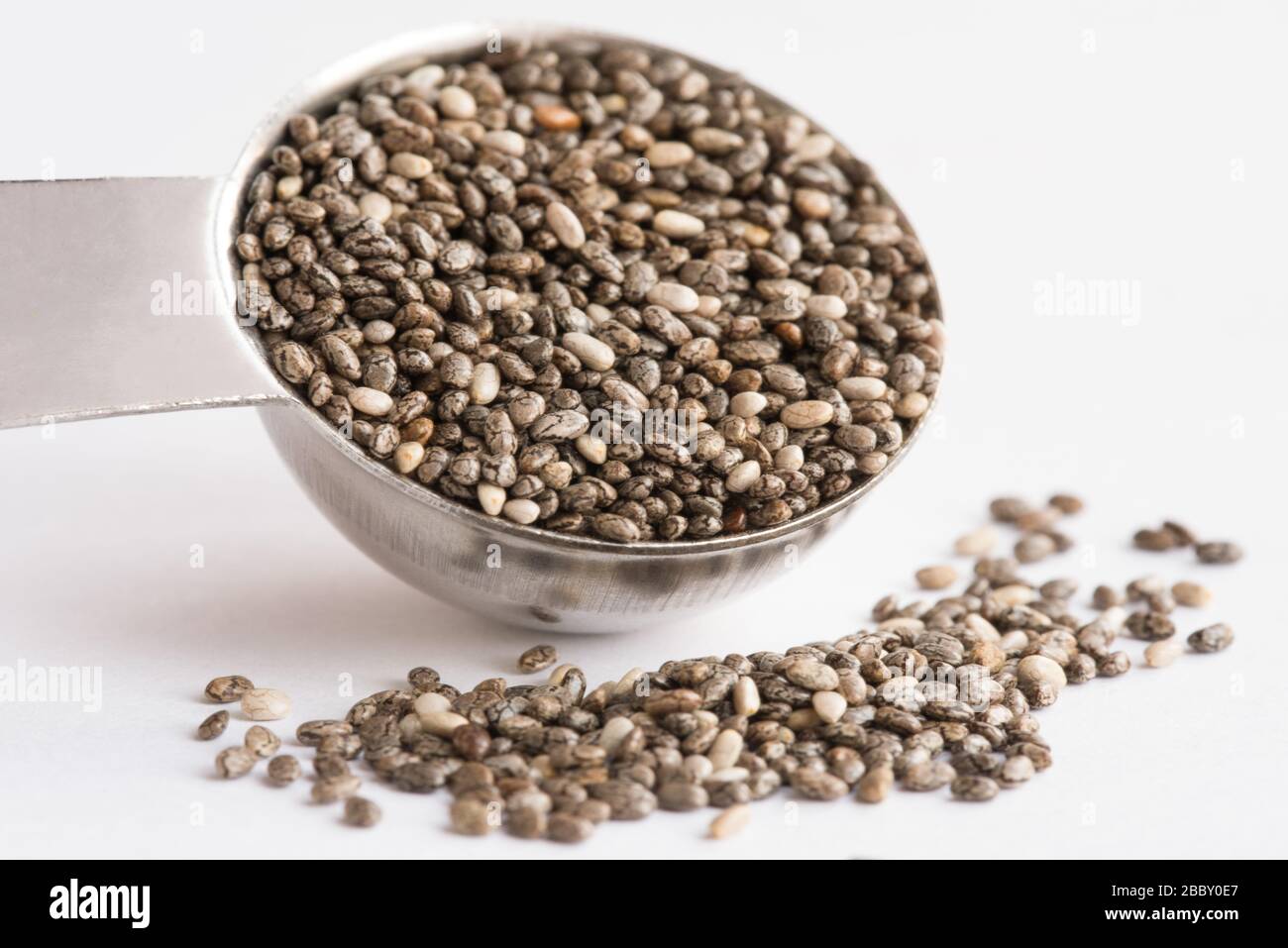 Black Chia Seeds Spilled from a Teaspoon Stock Photo Alamy