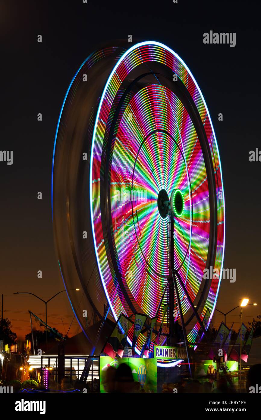 Lights on a spinning ferris wheel at dusk, Utah State Fair, Salt Lake