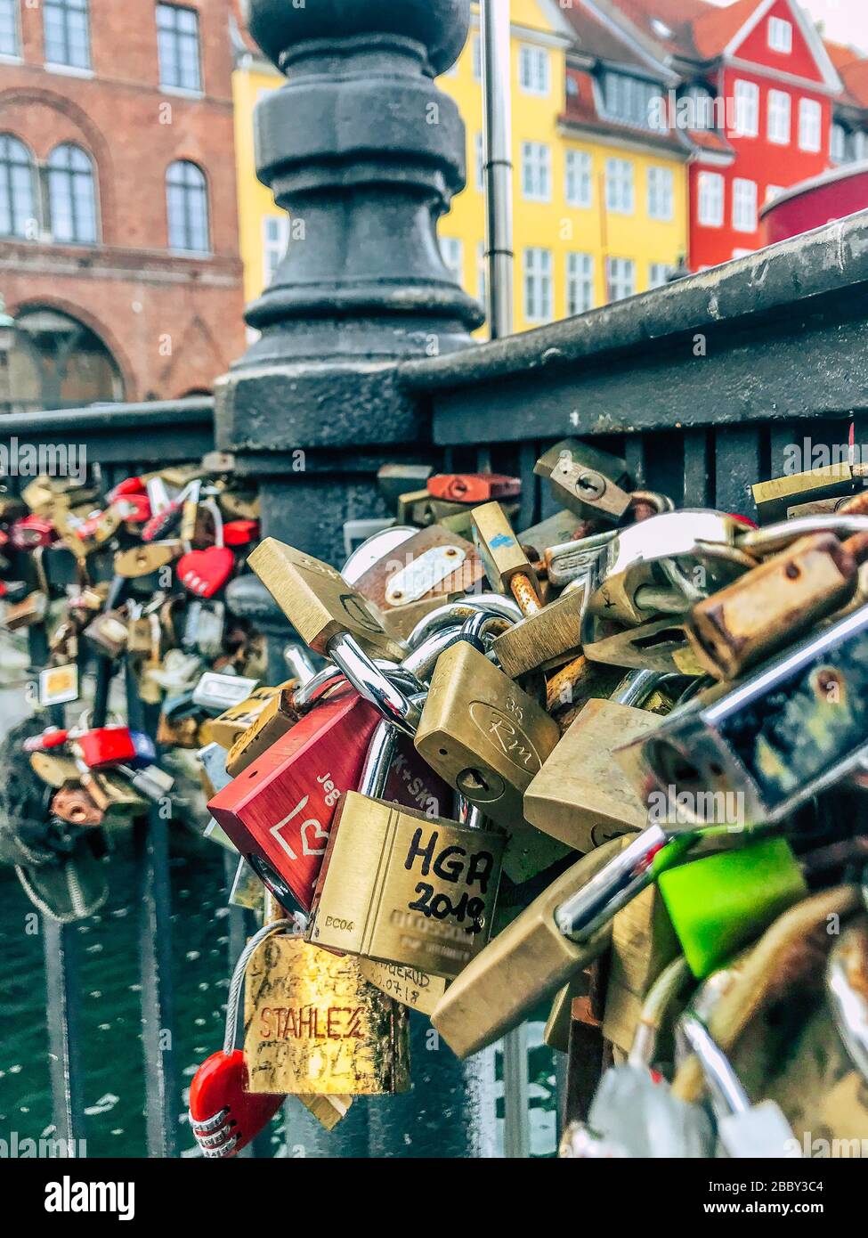 Many different love locks which closed on railing of the bridge. Nyhavn waterfront. Copenhagen, Denmark Stock Photo