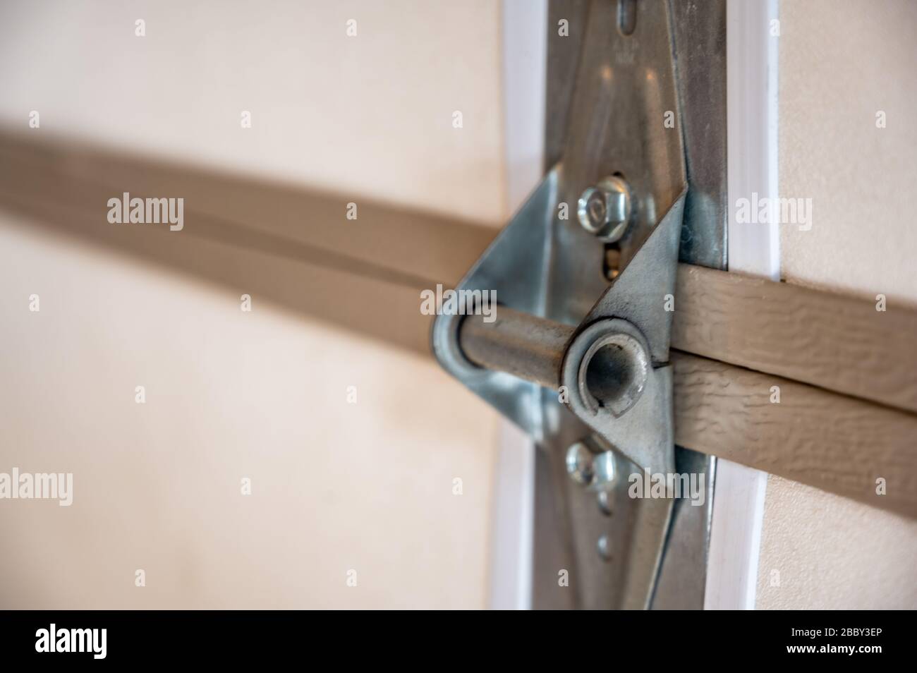Garage door metal panel hinge Stock Photo Alamy