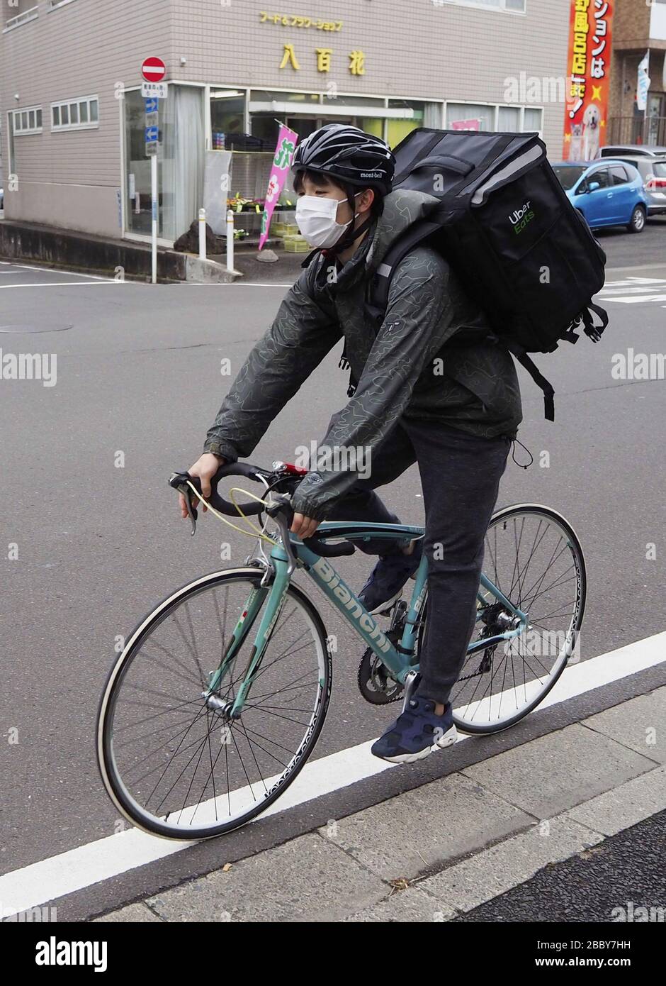 An Uber Eats deliverer cycles in Sendai, Miyagi Prefecture, on 